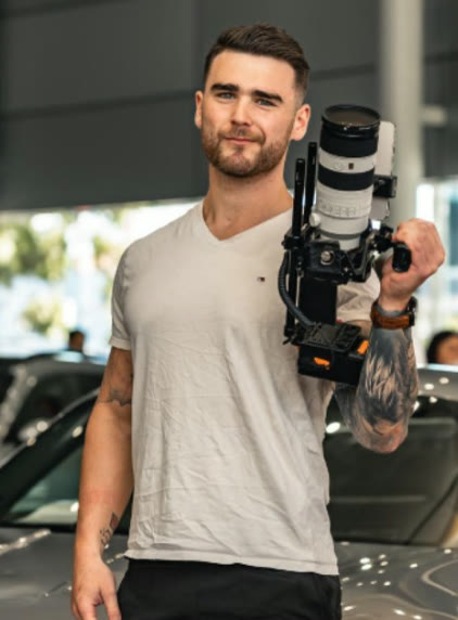 Brandon Hibbs holding a cinema camera rig